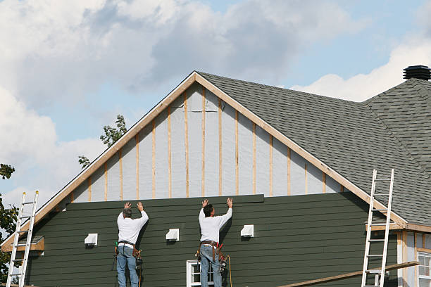 Professional Siding technician working in Norwood, NC